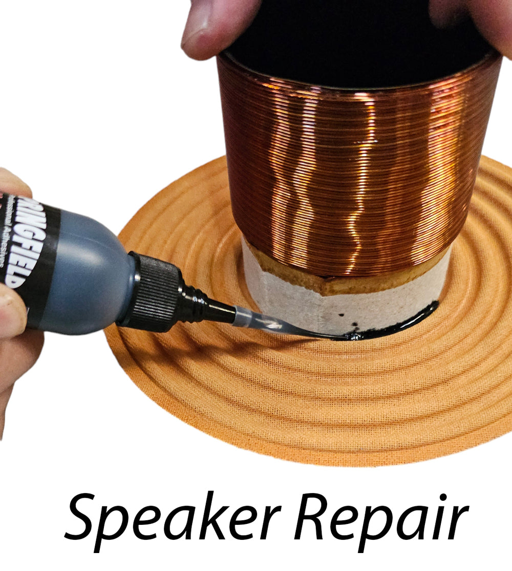 Speaker repair process with a hand applying glue to a speaker coil.